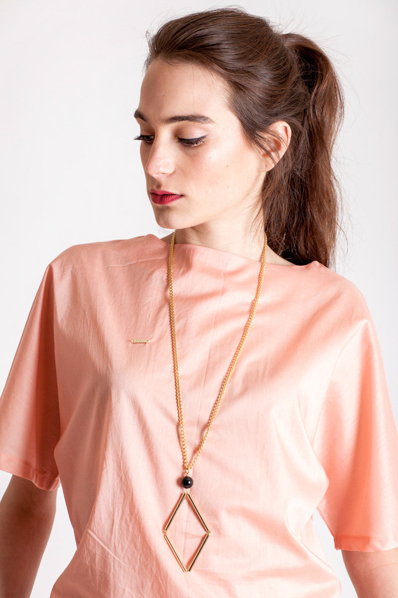 Norma necklace small features hand-cut, hand polished and galvanized brass and onyx.