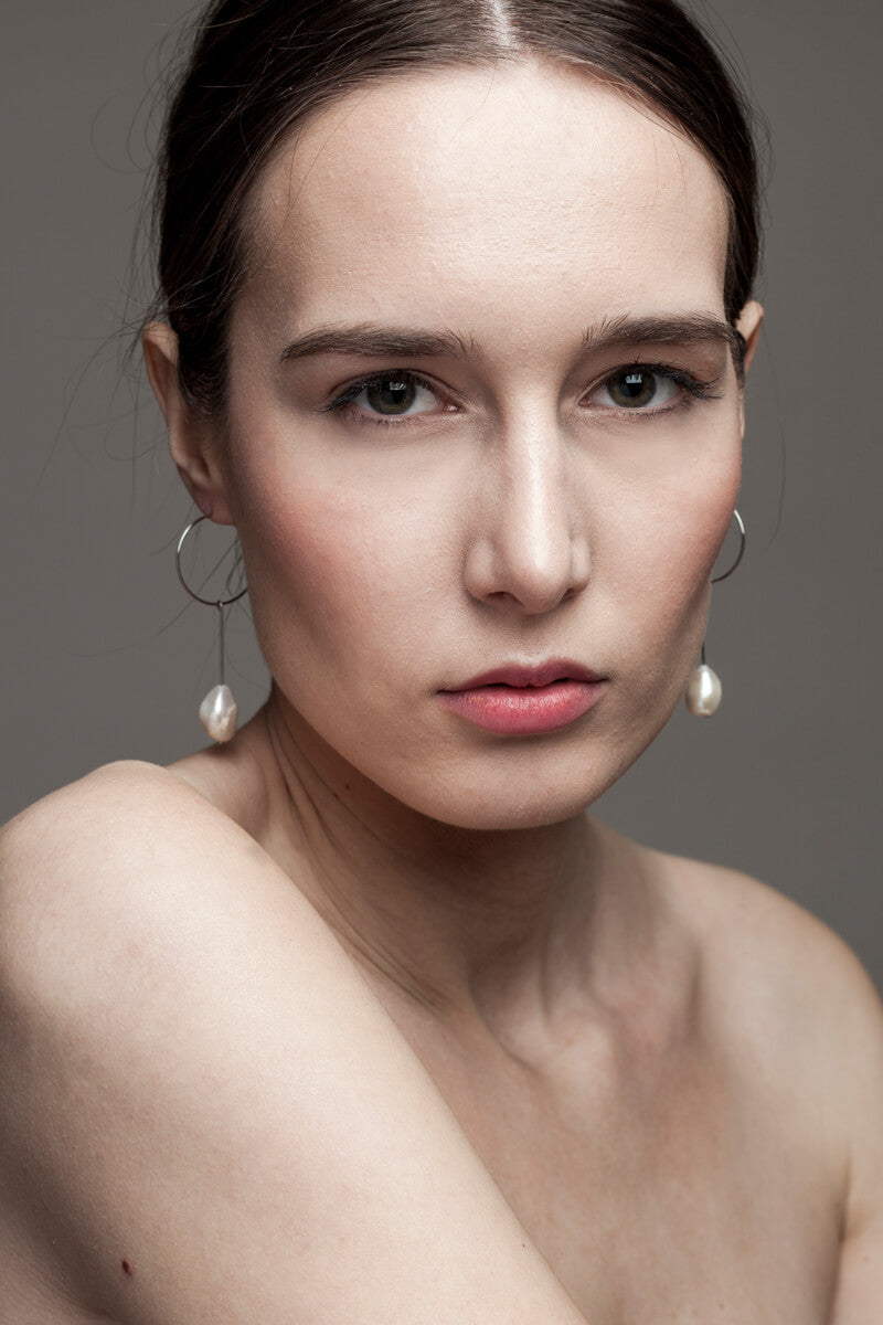 Slightly different white pearl earrings