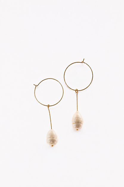 Slightly different white pearl earrings