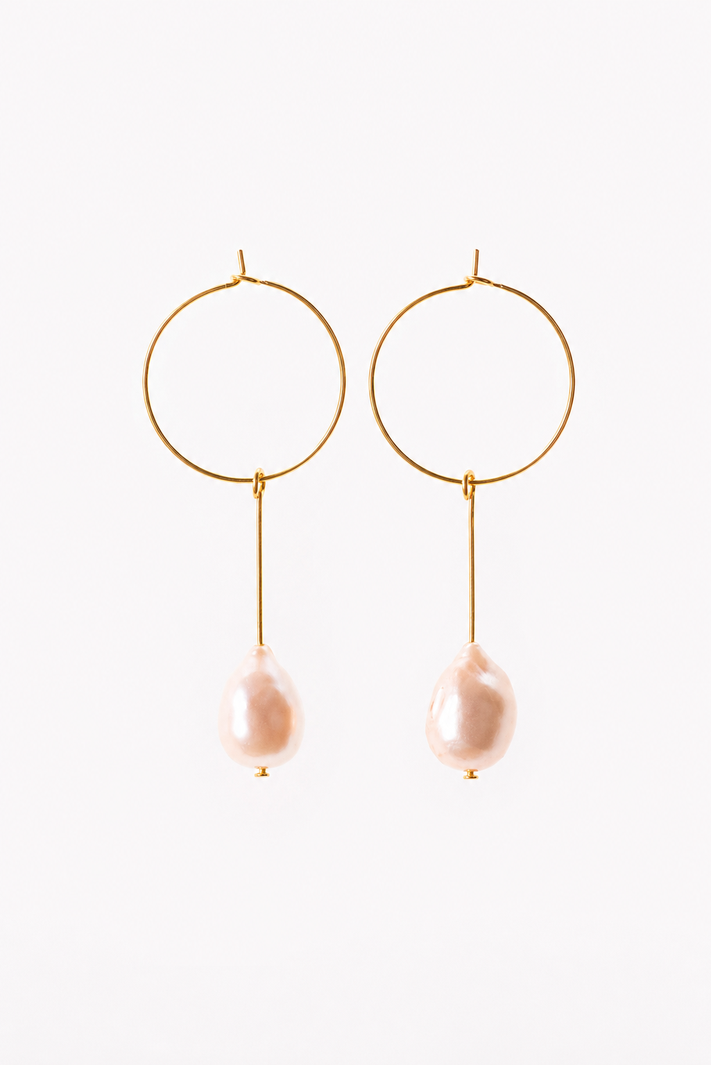 Slightly different pink pearl earrings