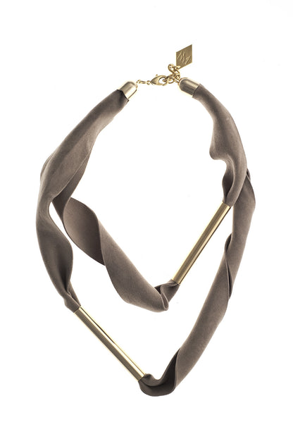 Embrassme necklace made of finest sheep napa, hand-cut, hand polished and galvanized brass and metal components. Beige-gold edition.