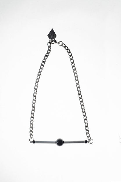 Line necklace made of hand-cut and galvanized brass, onyx and galvanized metal components.
