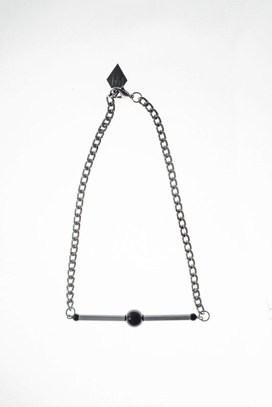 Line necklace made of hand-cut and galvanized brass, onyx and galvanized metal components.